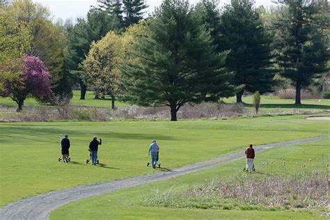 Golfers at Tekoa Country Club head out for a game Friday. - The ...