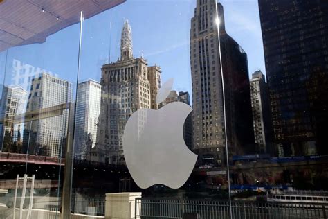 Apple share price: Apple tops $4 trillion market value for first time ...