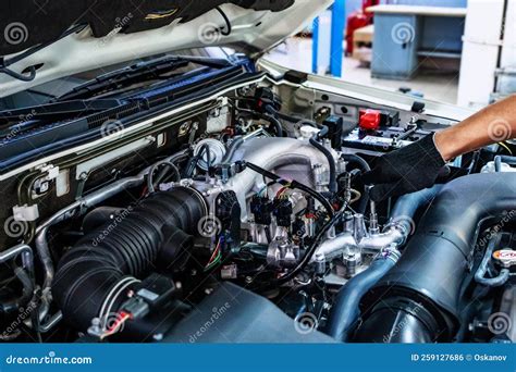 Auto Mechanic Working with Open Car Hood in Garage. Car Repair Service. Stock Photo - Image of ...
