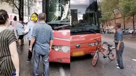 男子等公交接连3次被车溅水，扔伞砸车与司机互殴_一手Video-梨视频官网-Pear Video