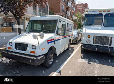 U.S. Postal Service (USPS) trucks are parked at a post office on August 23, 2024 in Glendale, Califo