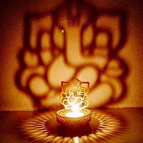 Buy eCraftIndia Shadow Ganesh Ji Metal Tea Light Holder (8 cm x 8 cm x ...