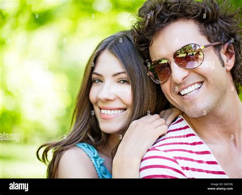Cute couple posing outdoors Stock Photo - Alamy