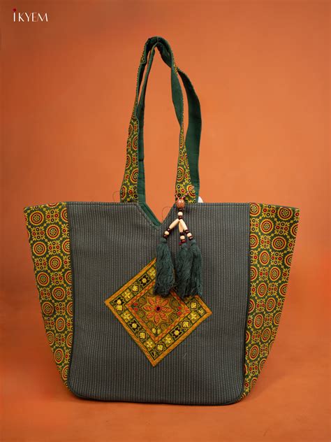 Ajrakh Aari work Hand bag - Green