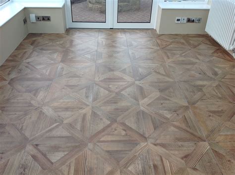 Parquet wood effect porcelain floor tiles give a fabulous finish to ...