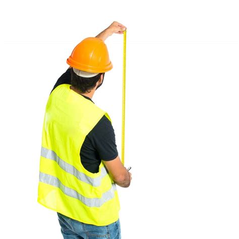 Workman with meter over white background | Free Photo
