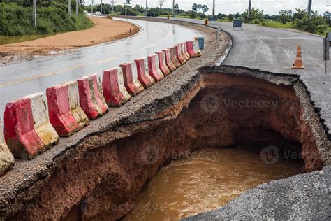 The road was destroyed by water erosion caused by heavy rain and flooding the road. 13089963 ...