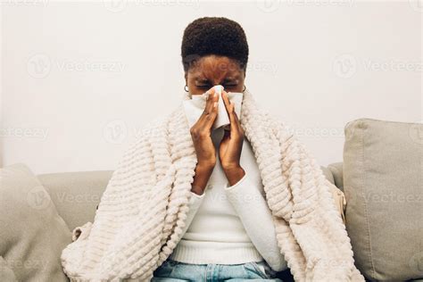 a black woman blowing their nose 17703858 Stock Photo at Vecteezy