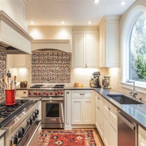 Contemporary L-Shaped Modular Kitchen Design With Pastel Green Cabinets