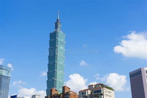 Photo of Taipei 101 tower against a blue sky.