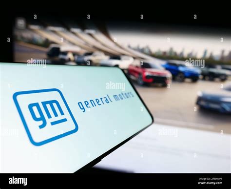 Cellphone with logo of US car manufacturer General Motors Company (GM ...