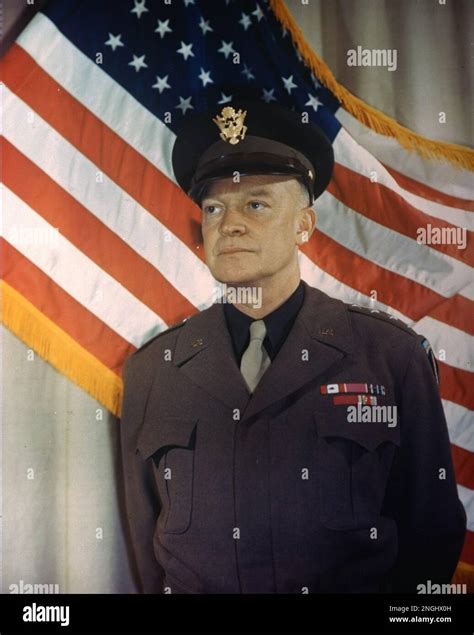 This is a 1945 photo of General Dwight D. Eisenhower, in military uniform and standing in front ...