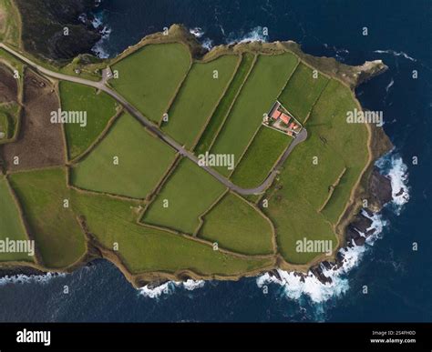 green grassland and rock land landscape of the Azores islands in the Atlantic ocean, touristic ...