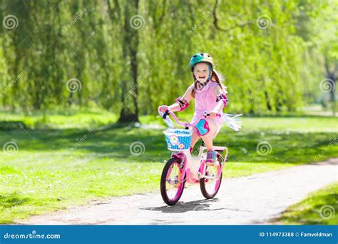 Child on Bike. Kids Ride Bicycle. Girl Cycling. Stock Photo - Image of ...