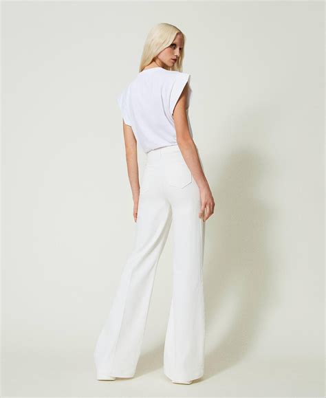 Flared white jeans with decorative buttons Woman, White | TWINSET Milano