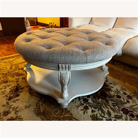 Ashley Realyn Ottoman Coffee Table - AptDeco