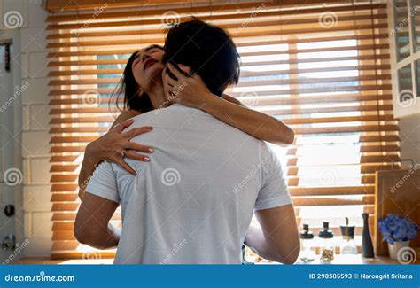 Back of Asian Man Kiss on Crook of the Neck of Woman Who Sit on Bench ...