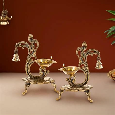 Buy DecorTwist® Brass Diyas for Pooja | Ethnic Carved Peacock Design ...