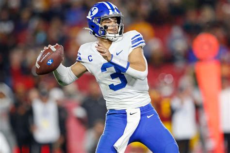 Download Quarterback Throwing Football Game Wallpaper | Wallpapers.com