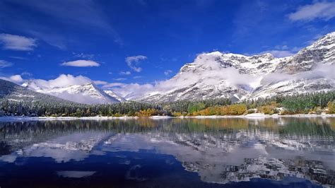 Download wallpaper 1366x768 mountains, lake, ripples, sky, clouds ...