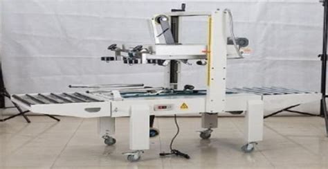 Carton Sealer With Strapping Machine Manufacturer, Supplier from Faridabad