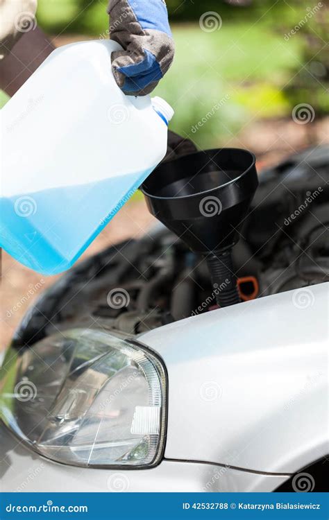 Adding Windshield Washer Fluid on a Car Stock Photo - Image of checking, safety: 42532788