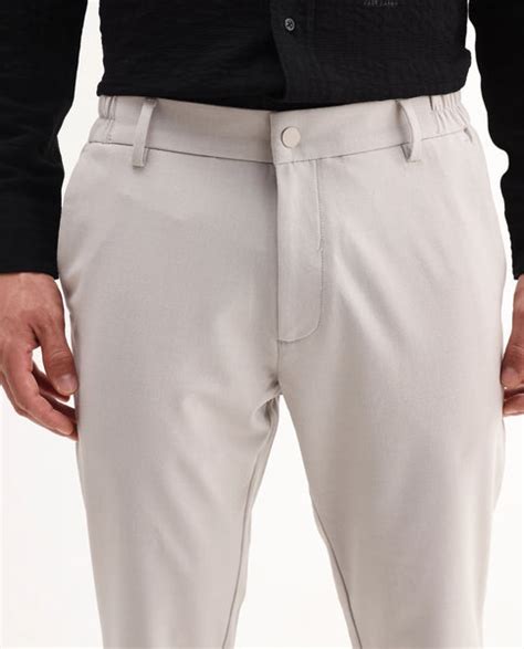 Buy Travel-Aw25 - Light Beige 8 Way Stretch Trouser| Rare Rabbit