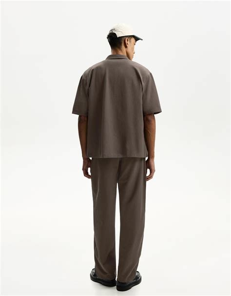 Pleated baggy jogger trousers - Men | Bershka