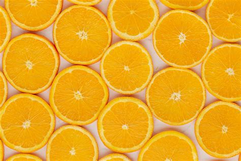 A bunch of oranges that are cut in half photo - Texture Image on Unsplash
