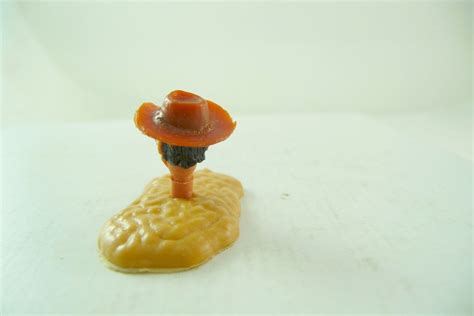 Timpo Toys Cowboy's head 3. version translucent brown hat ...