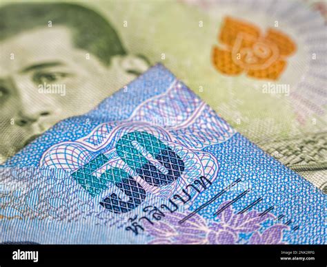 Macro detail with a 50 Thai Baht banknote. the baht is the official currency of Thailand Stock ... - currency of thailand