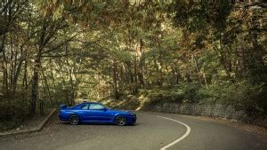 EurekaDesigns Nissan Skyline GT-R R34 on the forest road Poster Fine ...