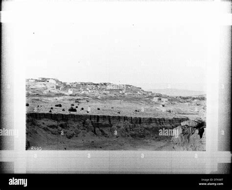 The Pueblo of Laguna is seen in the distance beyond a natural basin or ...