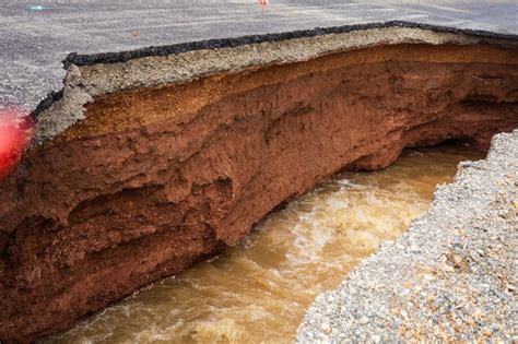 The road was destroyed by water erosion caused by heavy rain and ...