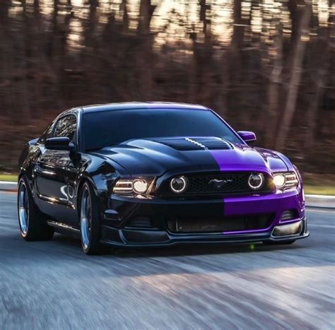 Purple and Black Mustang Car Driving Down the Road