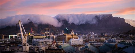 Download wallpaper 2560x1024 houses, buildings, mountains, clouds, city ...
