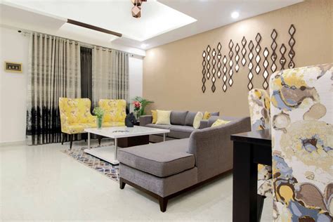 Gurgaon 2-BHK Flat Design With Grey And Yellow Living Room | Livspace