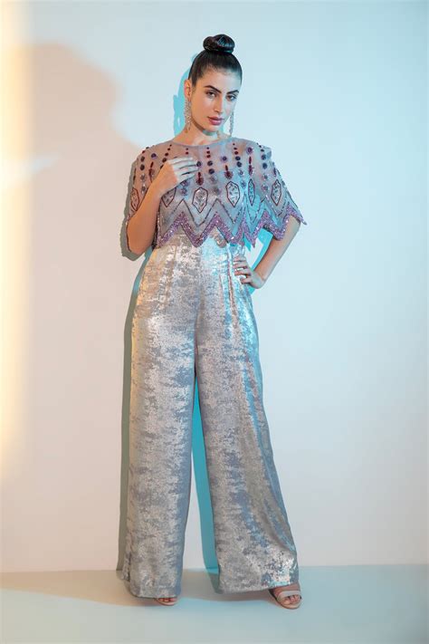 Grey Metallica jumpsuit with embellished cape
