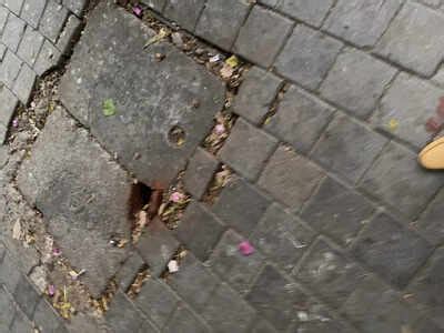 Footpath potholes and garbage @ Colaba Wodehouse - Times of India