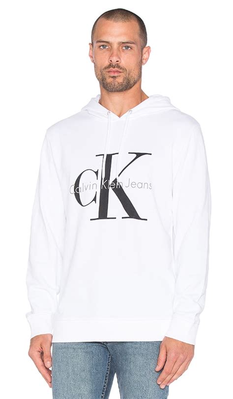 Calvin Klein Longsleeve Logo Hoodie in White | REVOLVE
