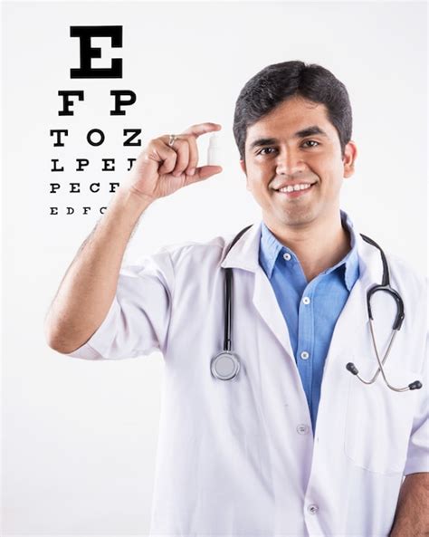 Handsome indian ophthalmologist or optometrist or eye specialist ...