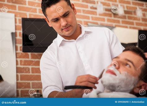 Hispanic Barber Shaving a Man Stock Photo - Image of shop, grooming ...