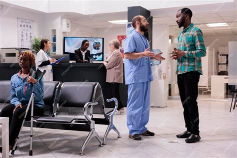 Premium Photo | Surgeon explaining patient condition to african ...