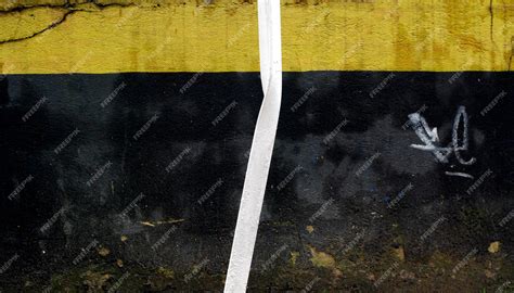 Premium Photo | A white tape is tied to a black and yellow flag.