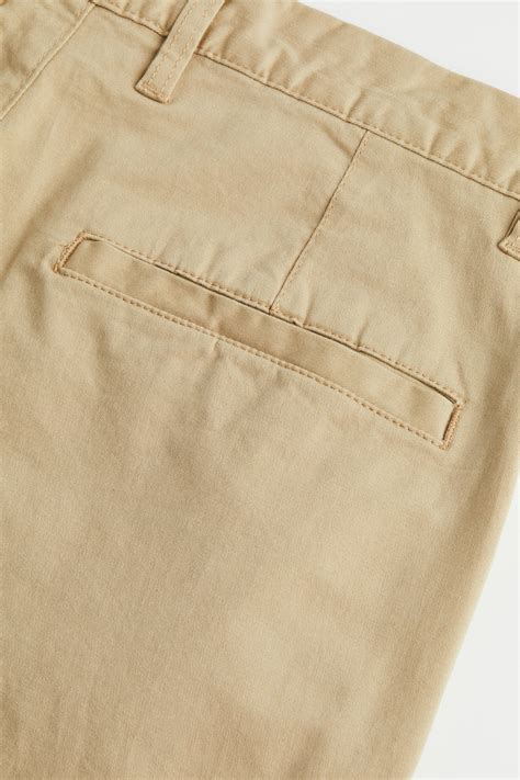 Men’s Beige Relaxed Fit Cotton chinos | H&M IN