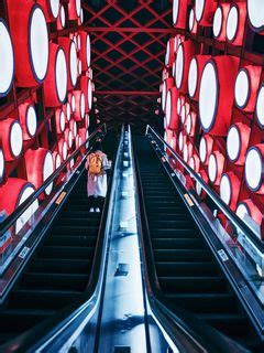 Download wallpaper 240x320 escalator, interior, lights, man, steps, red ...