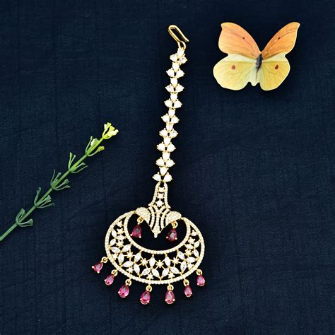 Trendsetting Ruby & White CZ Studded Tikka for women | Violet & Purple ...