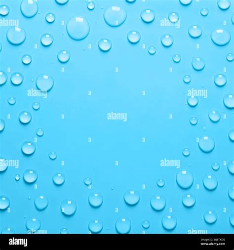 Square Frame of Water drops on a pastel blue background. Water texture ...