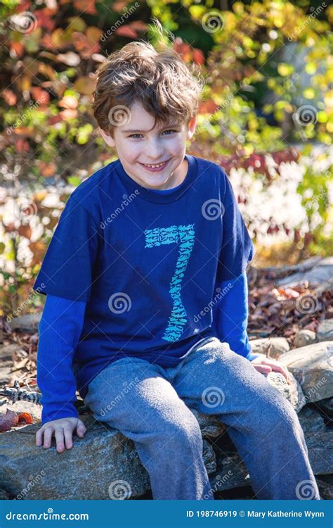 Portrait of Seven Year Old Boy Outside Stock Image - Image of laugh ...