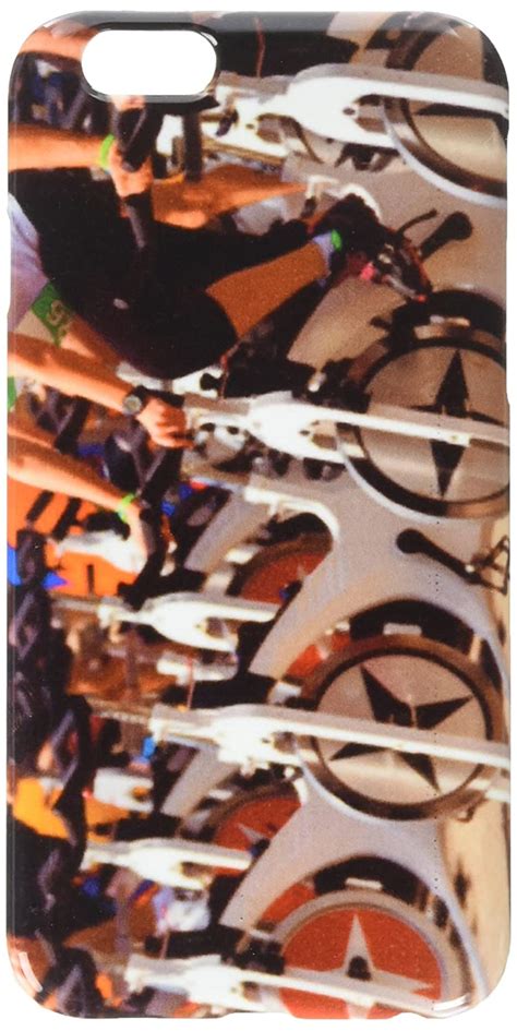 Stationary spinning bicycles outdoor in a sunny day. aerobic cell phone ...